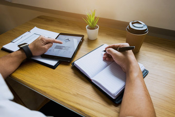  Businessman using tablet to the situation on the market value , Business concept.