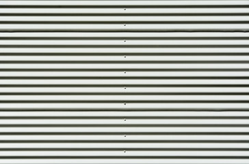 Obraz premium Corrugated white painted metal sheet texture background