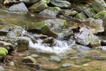 Naklejka na ściany i meble Waterfalls in the stream