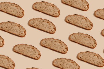 sliced of rye bread, isolated on a brown background
