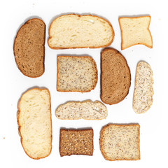 Set of several slices of different bread on a white background.