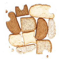 Set of several slices of different bread on a white background.