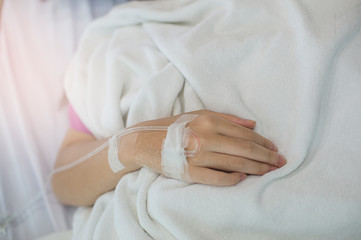 Focus on hand of a woman patient in hospital 