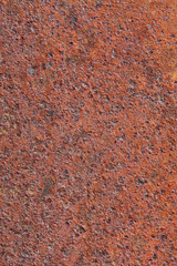 A sheet of metal covered with rust, which shows the corrosion of metal.