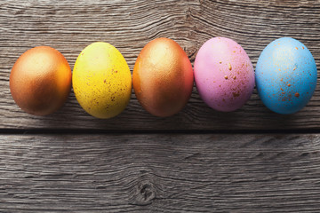 Easter eggs on wooden background.