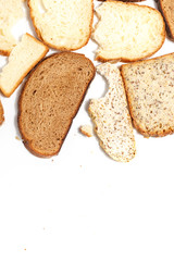 Set of several slices of different bread on a white background.
