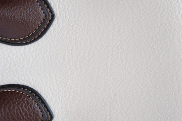 The texture of the material of the skin is white with brown inserts, close-up.