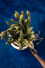 fresh asparagus in ceramic pot. Macro photography