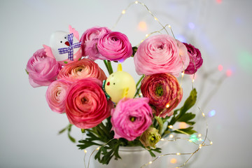 Ranunkeln in pink, macro, spring , flowers Ranunculus asiaticus with easter egg