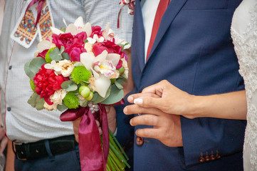 bride and groom holding wedding bouquet