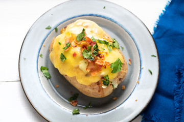 Baked potato with bacon and cheese