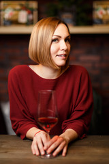 Photo of smiling woman with wine glass