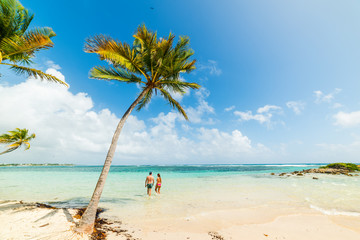 Young couple in a beautiful beach of the Caribbean sea