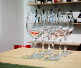 Glasses of wine. Glasses hanging above the bar in the restaurant. Empty glasses for wine