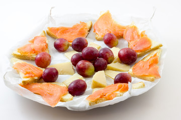 Salmon appetizer with grapes and cheese