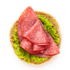 Sandwich with salami sausage on white background.