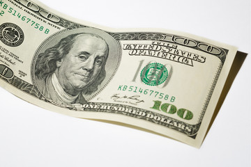Close up hundred dollar banknote on white background