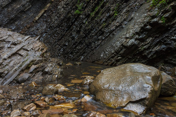 Stones at the foot of the waterfall