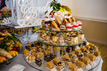 The colored cakes are laid out on the trays