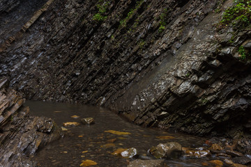 Stones at the foot of the waterfall