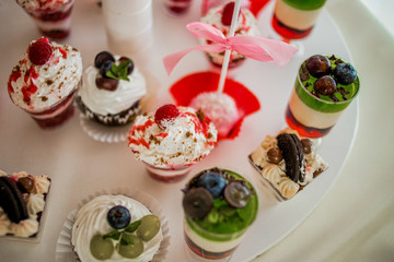 The bright cupcakes are laid out on the trays