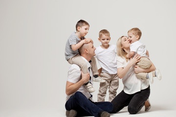 Big and cheerful family, mom dad and three sons. Happy together