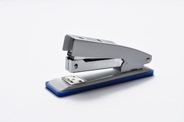 Big silver stapler is isolated on a white background