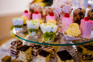 Beautiful cupcakes are laid out on the trays