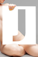 nude girl holding stencil letter j
