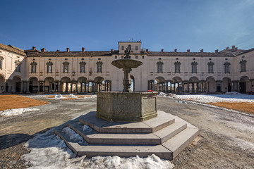 Panoramic view of the inner courtyard of the seventeenth-century monumental complex dedicated to the Virgin Mary, of the Sanctuary of Oropa in Piedmont, Italy.