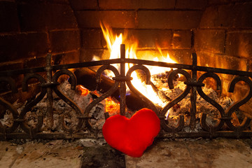 heart in front of the fireplace. the fire. love