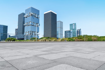 Urban skyscrapers with empty square floor tiles