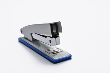 Big silver stapler is isolated on a white background