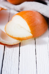 onion cutting on white wooden background
