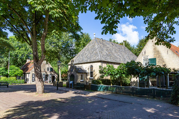 Beautiful old houses on a small square in the place Nes on the island Ameland