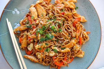 Buckwheat noodles with vegetables and chicken breast in the sauce teriyaki