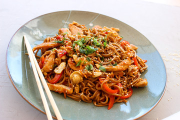 Buckwheat noodles with vegetables and chicken breast in the sauce teriyaki