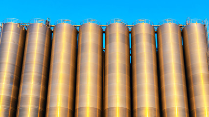 Chemical plant, containers . Storage tanks for petroleum products. Equipment refinery . White tanks for petrol and oil in tank farm with blue sky .