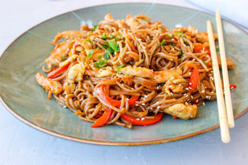 Buckwheat noodles with vegetables and chicken breast in the sauce teriyaki
