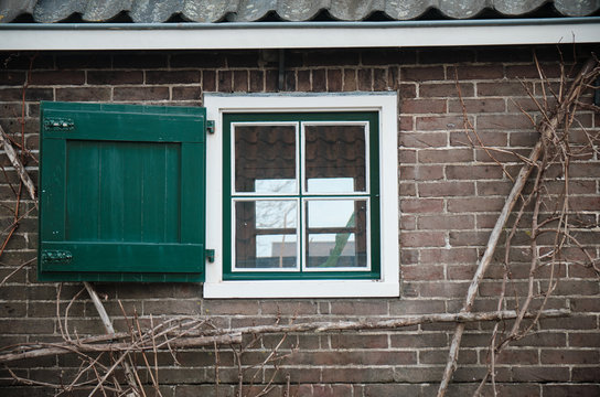 old house windows of Group of 19 monumental windmills - Molens of Kinderdijk - South holland