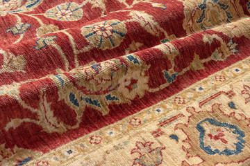 Close up of a handmade afghan Chobi oriental carpet