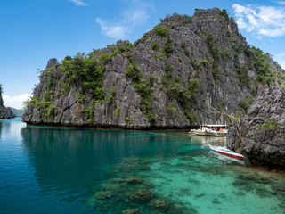 Stones of Barracuda lake on Coron Island. Lake surrounded by limestone cliffs, is a popular tourist...