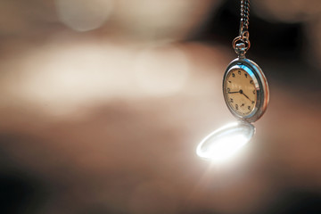retro clock on a rope on a beautiful background