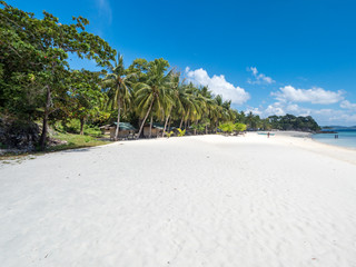 View of tropical beach on the island Malcapuya. Beautiful tropical island with sand beach, palm trees. Travel tropical concept. Palawan, Philippines. October, 2018