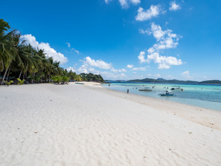 View of tropical beach on the island Malcapuya. Beautiful tropical island with sand beach, palm trees. Travel tropical concept. Palawan, Philippines. October, 2018