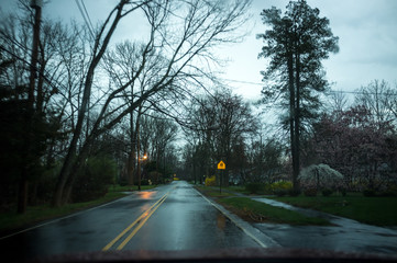 Fototapeta premium driving on a moody dark and rainy day at the beginning of spring