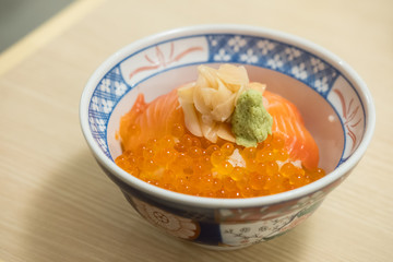 Salmon Sashimi rice bowl, served on the table