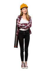 A full-length shot of a Architect woman looking up while smiling over isolated white background