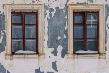 Fototapeta na wymiar windows in a brick house with a bare facade