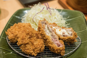 cheese tonkatsu pork cutlet with rice and vegetable set, soft focus